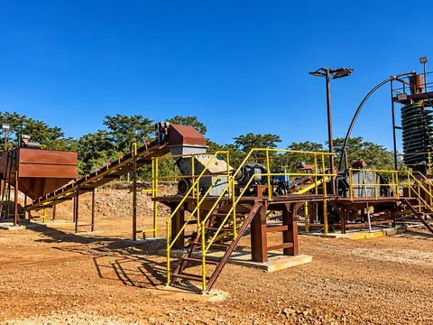 Conveyors, platforms and spiral concentration equipment in an outdoor processing facility.